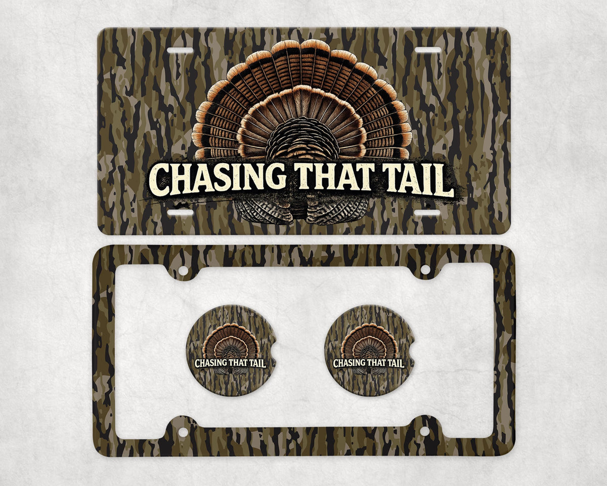 May include: A license plate and car accessories set with a camouflage pattern. The license plate features a turkey tail design and the text "CHASING THAT TAIL". The set includes a license plate frame and two matching car coasters.