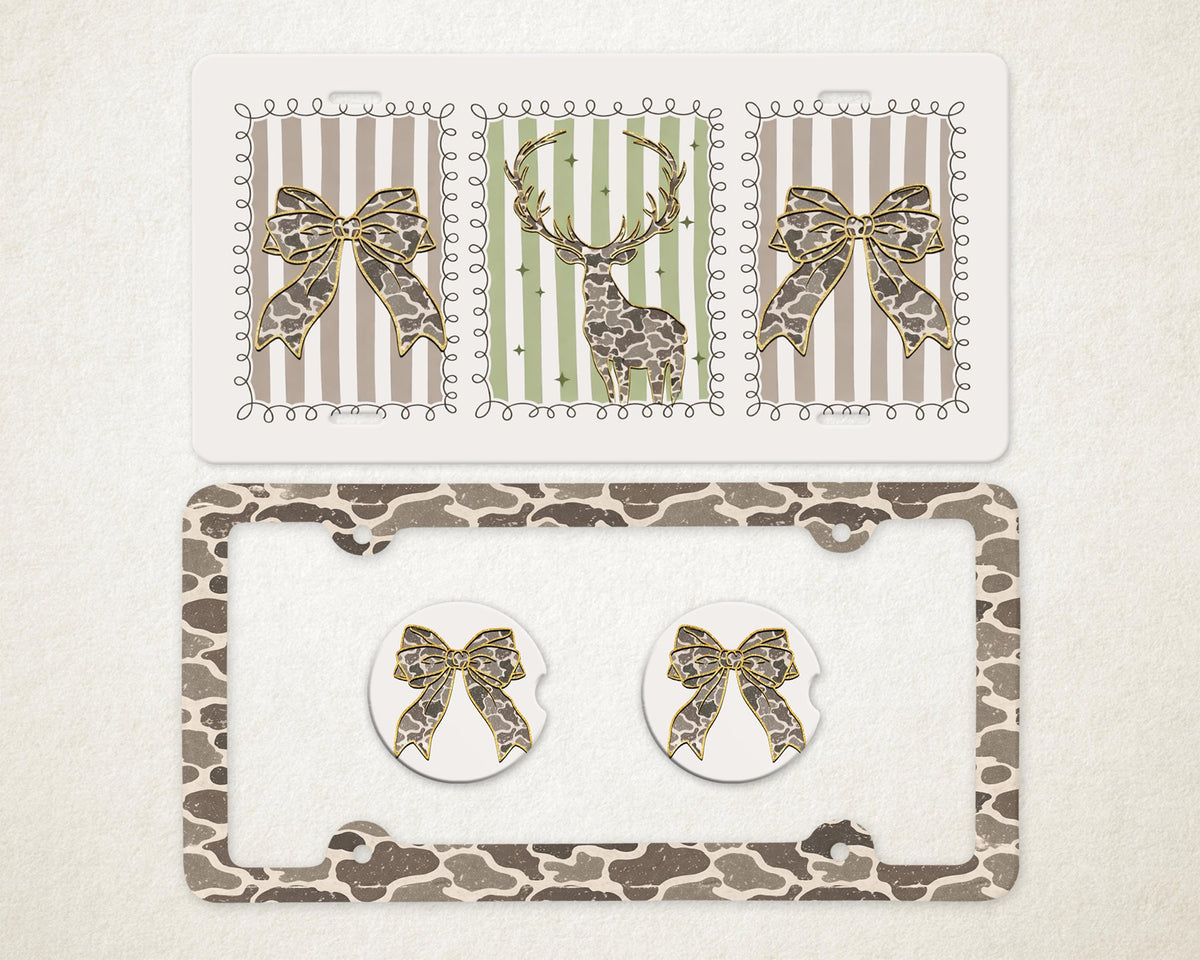 May include: A decorative car accessory set featuring a license plate frame, license plate cover, and two car coasters. The license plate cover and coasters have a giraffe print. The license plate cover has a bow design. The license plate cover has a deer design.
