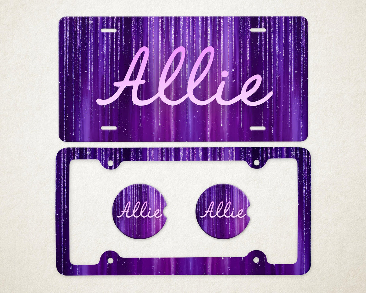 May include: A purple license plate and frame set with the name "Allie" in a cursive font. The background has a vertical streak design. Two matching car coasters are included, each with the name "Allie".